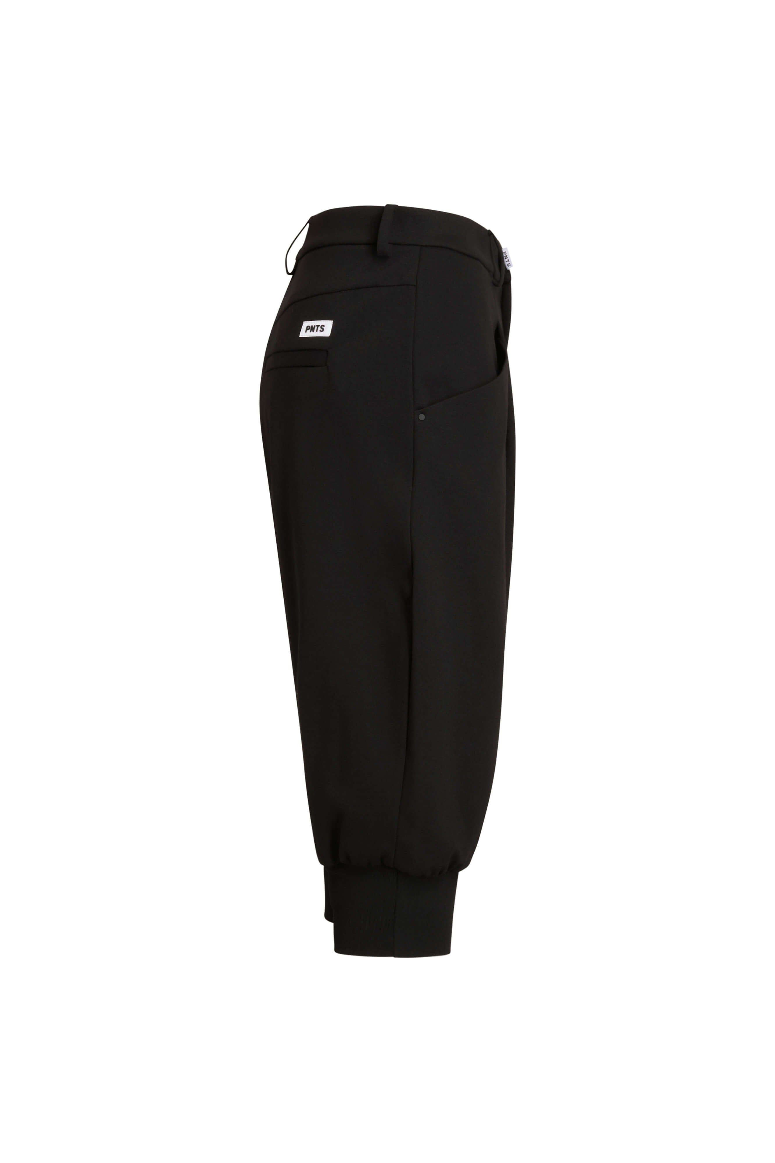 Schwarze Hose mit Bündchen, Seitenansicht.